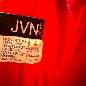 Sophisticated and stunning red dress. Size 4 and designer is JVN 100 polyester